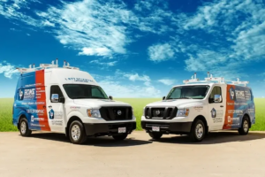 A banner Lochridge Priest service vans