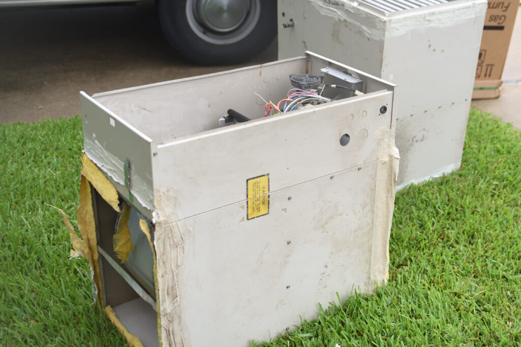 An old furnace that has been removed in preparation of a new furnace to be installed