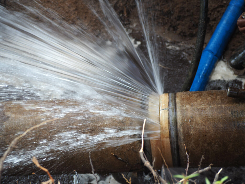 Burst pipe spraying water