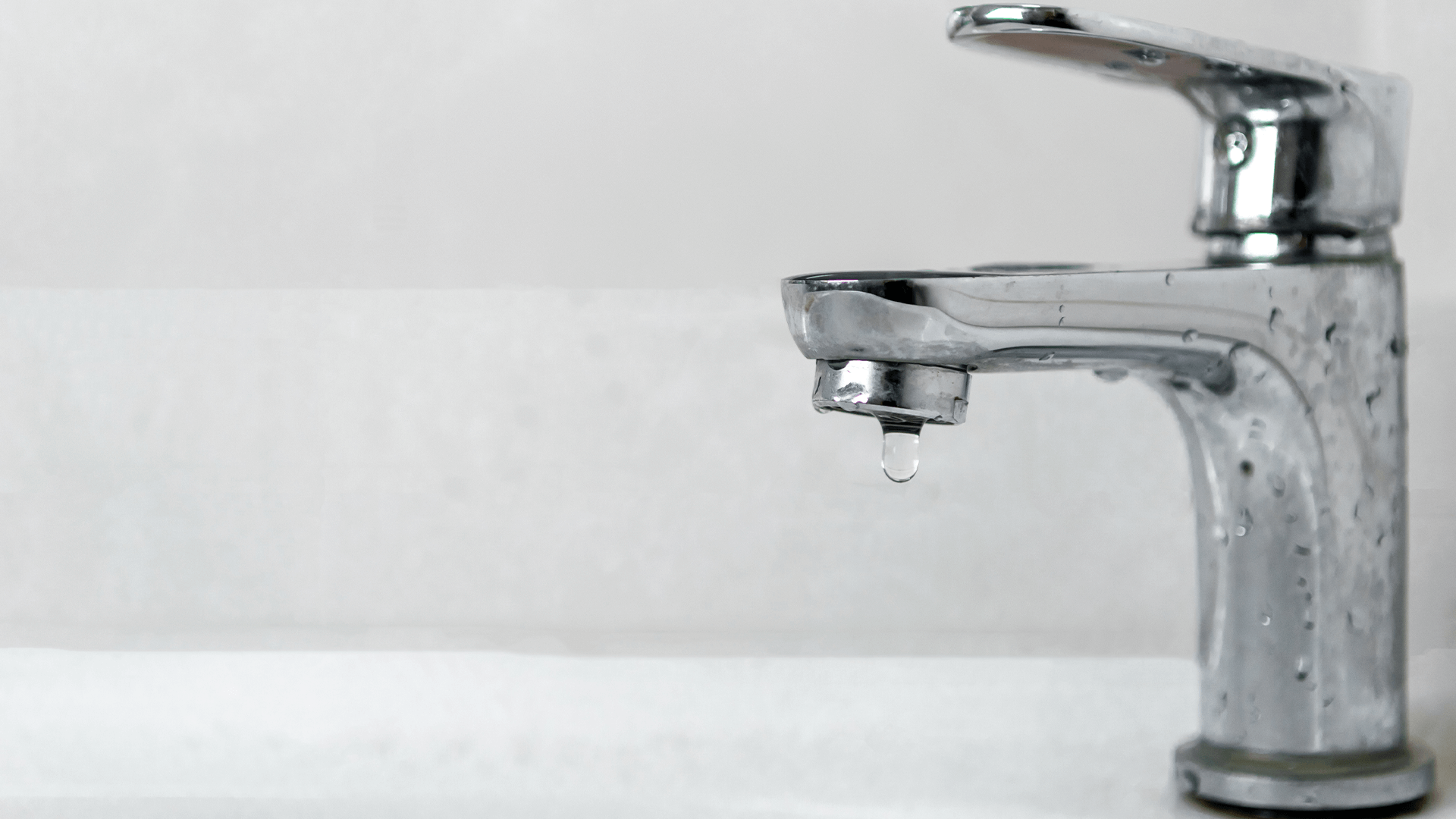 Dripping faucet in bathroom