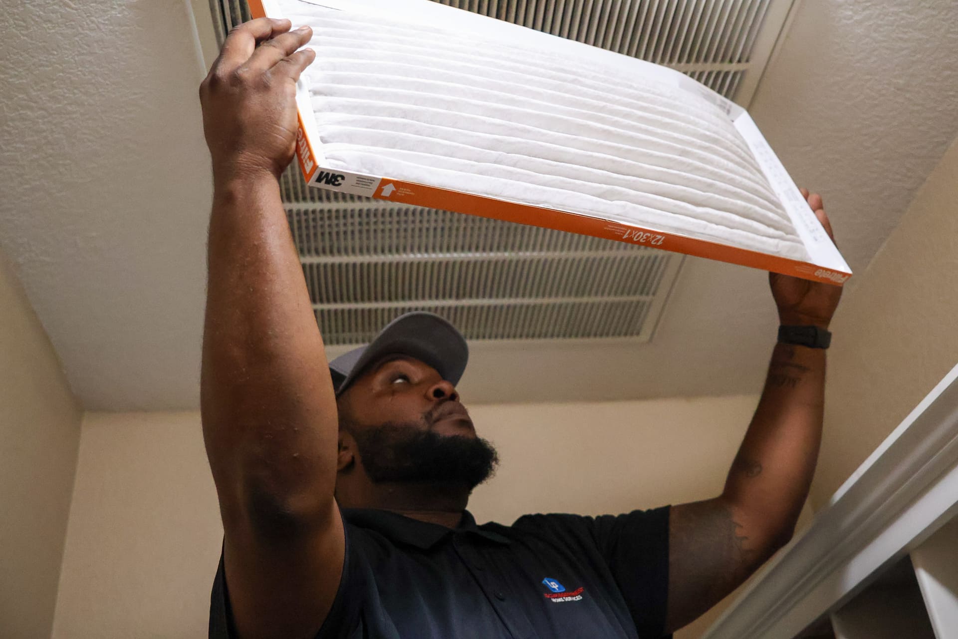 Lochridge Priest technician holding an air filter