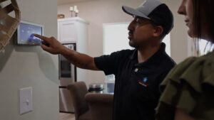 thermostat-on-wall-finger-making-changes