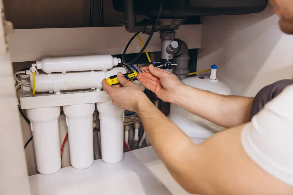 Technician servicing a water filtration system